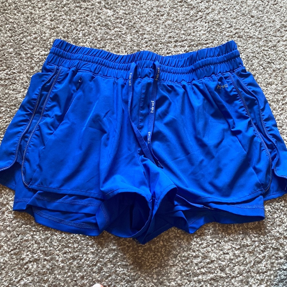 Blue workout shorts. Built in spanx. 1 zipper pocket. Jaw string ties!